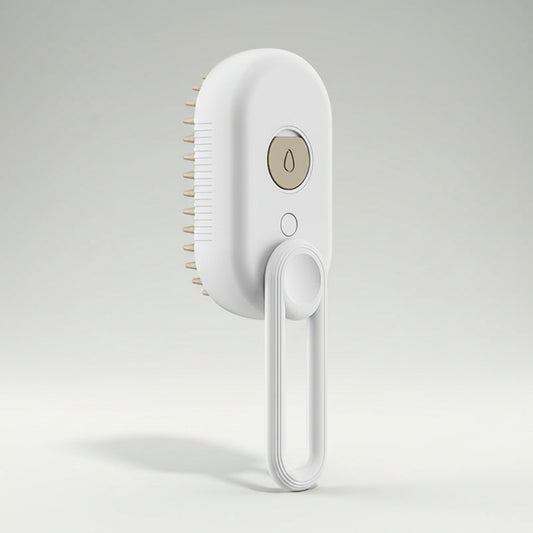 A white electric hairbrush with a hanging loop handle and a gold-colored power button, shown against a solid white background.